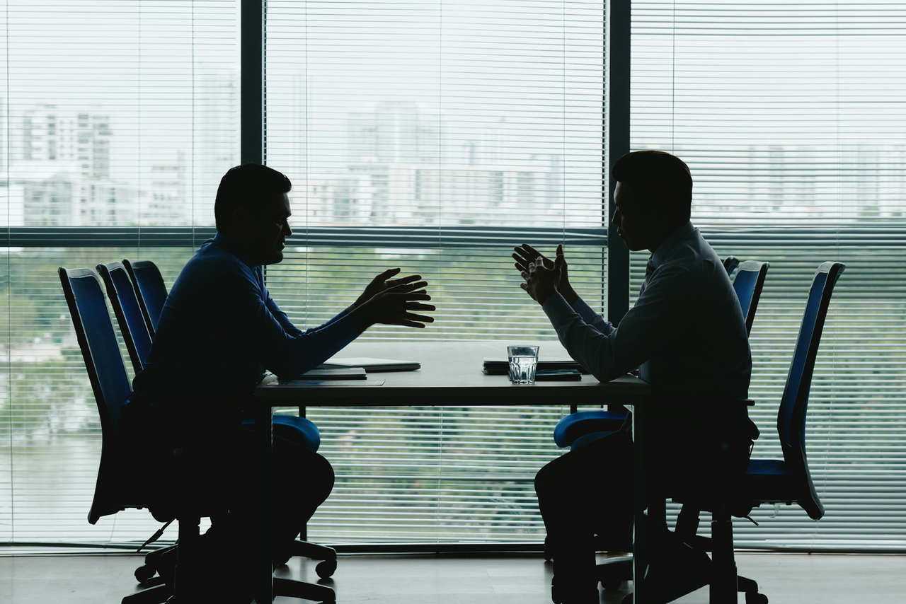 Two men negotiating a business loan