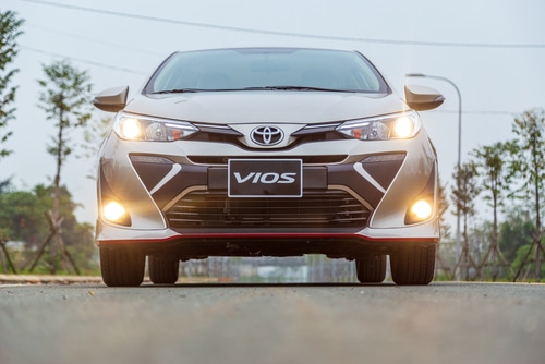 A Toyota Vios on the road. This is to illustrate the article's discussion of cars with the best resale value.